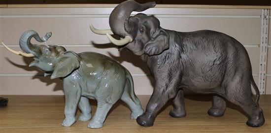 A large Beswick model of an elephant and another (tusk a.f.)